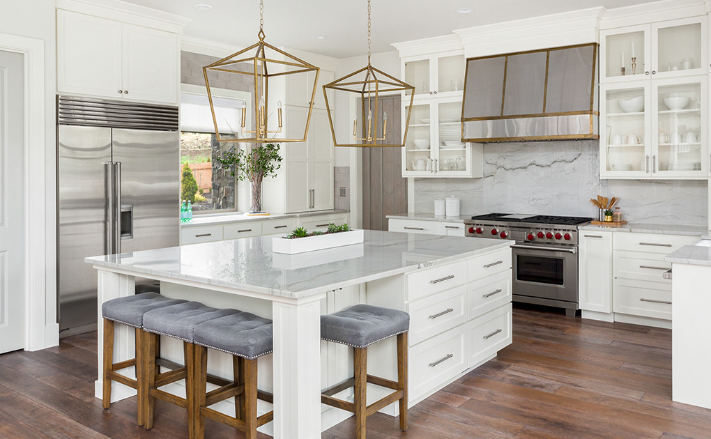 high end kitchen with marble and gold accents